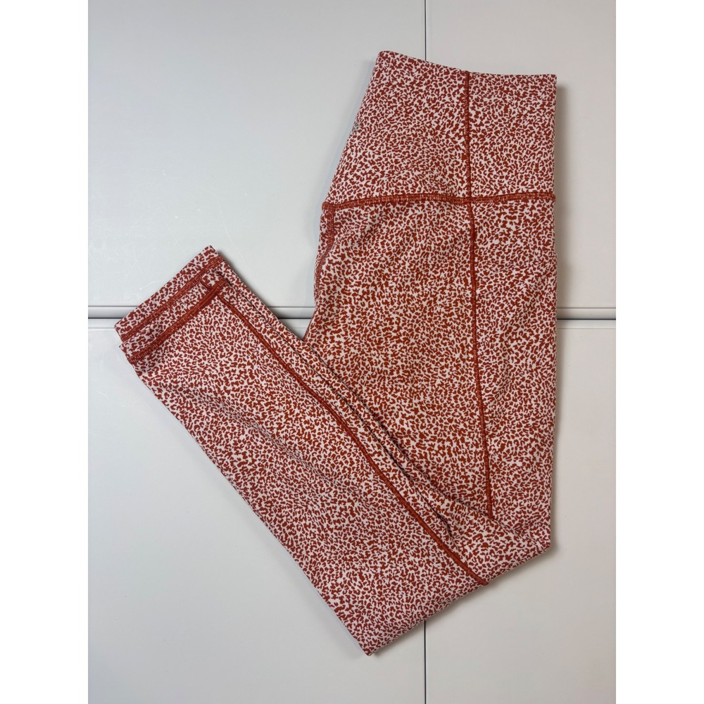 Athleta Salutation Stash II Textured Tight Rust Orange White‎ Animal Print Small